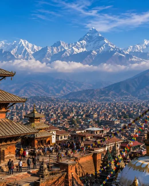 A pagoda temple and stupa above the Kathmandu valley, the Himalaya behind